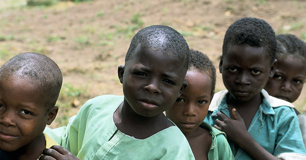 Soil-transmitted-helminth-intestinal-worms Young children queuing to get treated against intestinal worms during MDA.