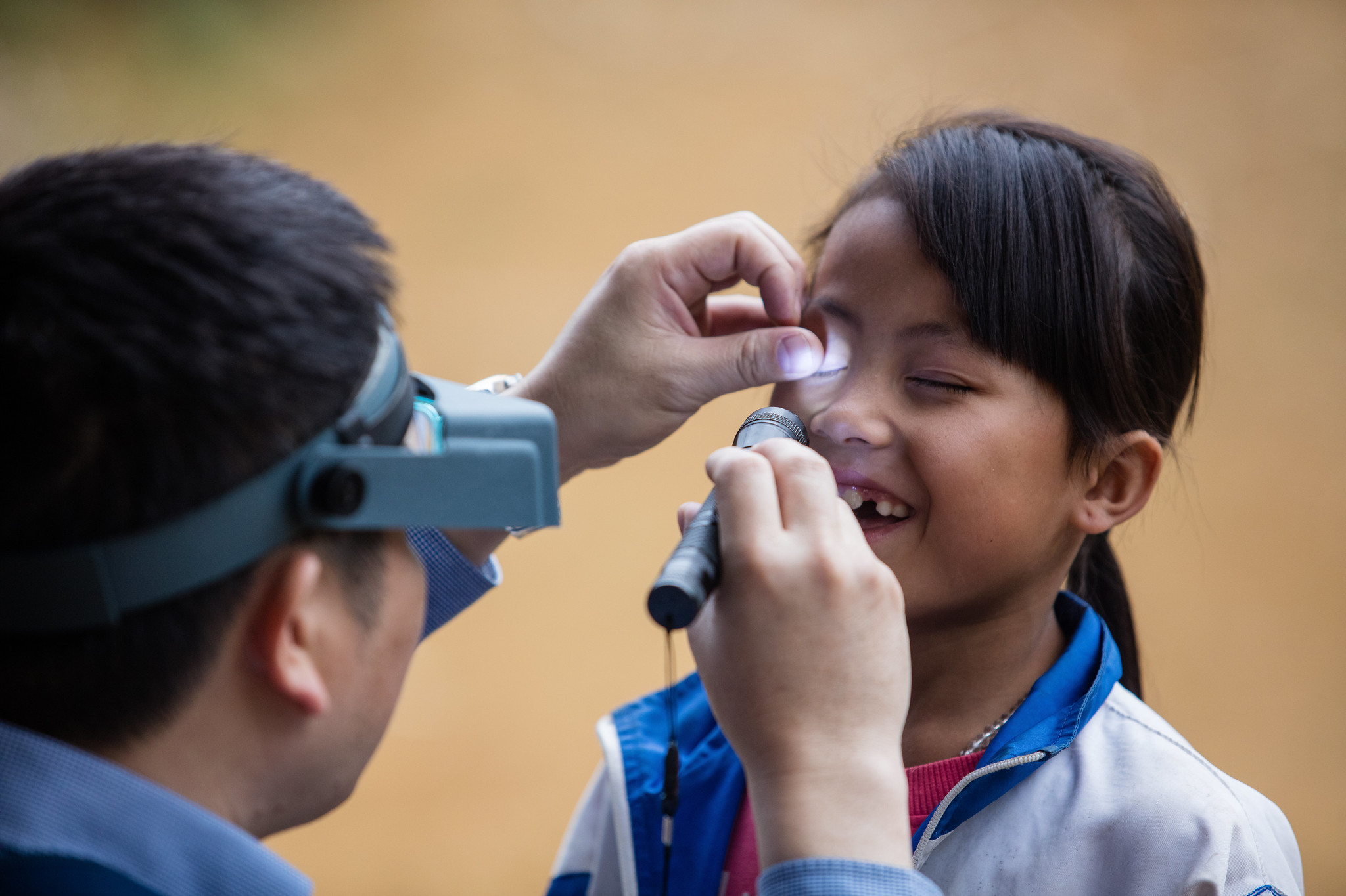 Checking for Trachoma in Vietnam RTI International Nguyen Minh Duc A young girl's eyes are checked for trachoma during a survey in Vietnam. USAID's Act to End NTDs | East program is supporting the country to eliminate trachoma, a disease which can lead to blindness.