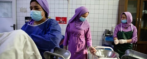 WHO-20221121-MalalaiHospital Inside a delivery room, midwives in training help deliver babies under the supervision of the head midwife, Afghanistan