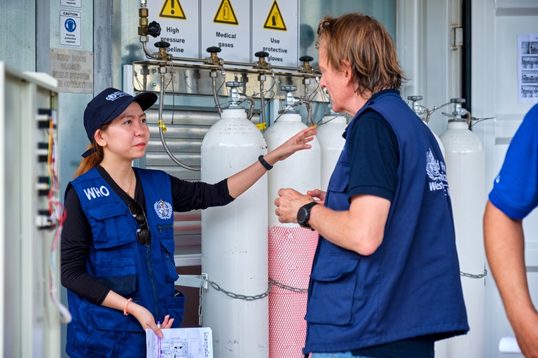 _XH22409 man checking the oxygen tanks