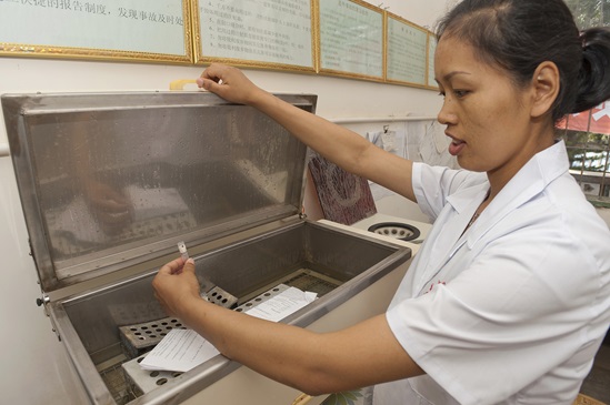 A nurse picks up a blood sample