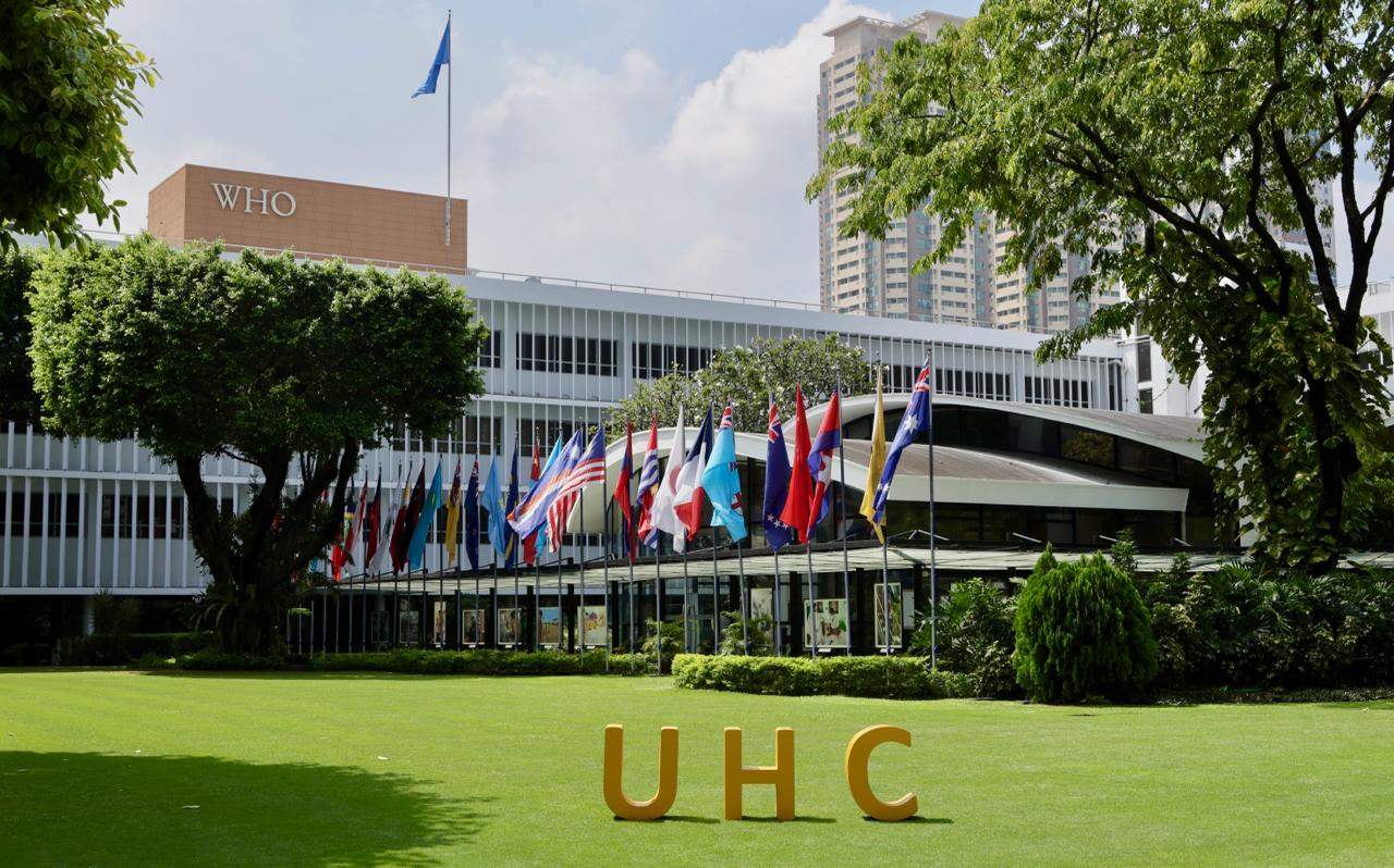 WPRO building with UHC UHC letters sit on the lawn outside the WHO Western Pacific Office
