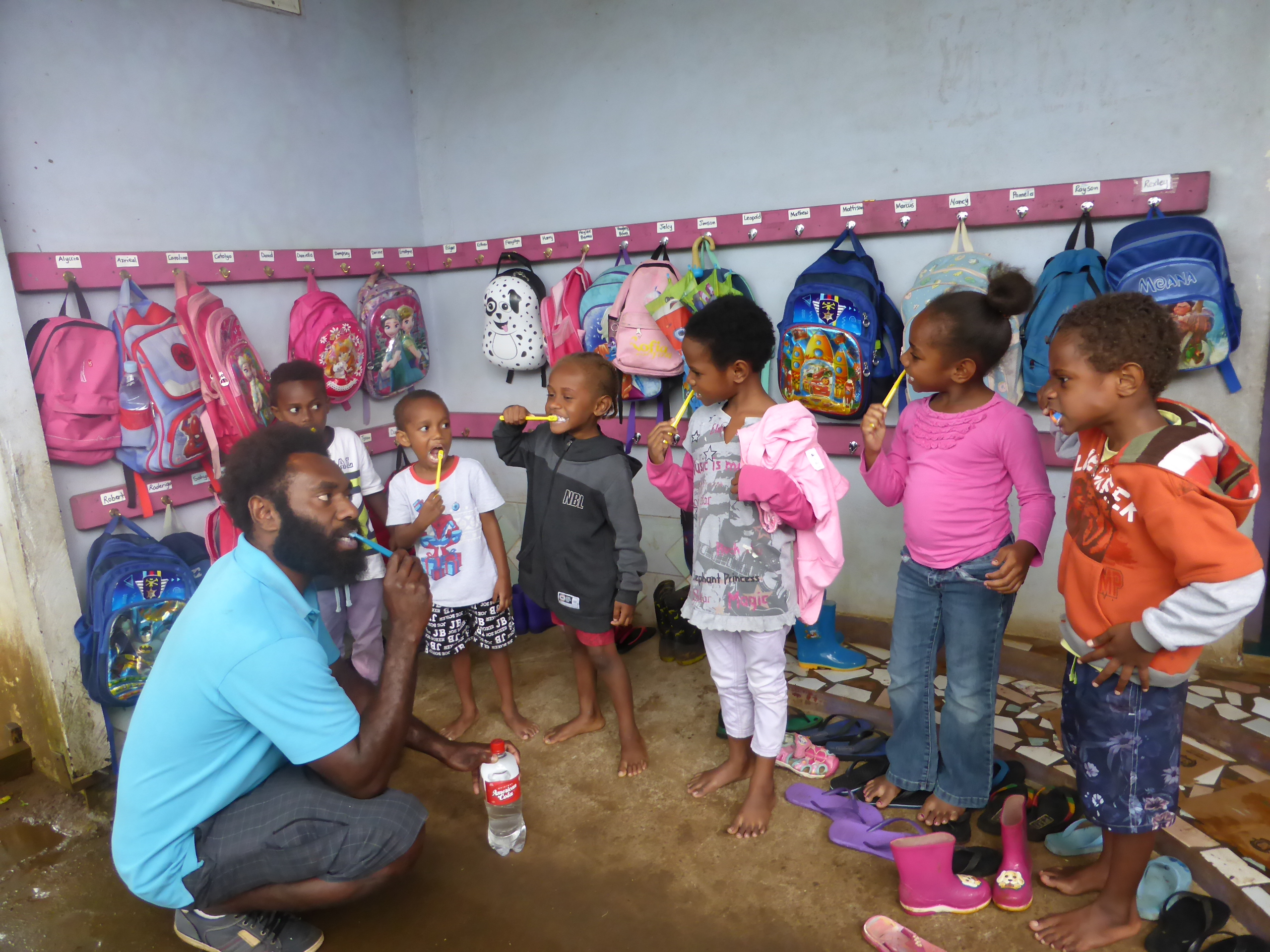 Vanuatu oral health 1 A dental assistant is teaching students how to brush teeth in Port Vila, Vanuatu.